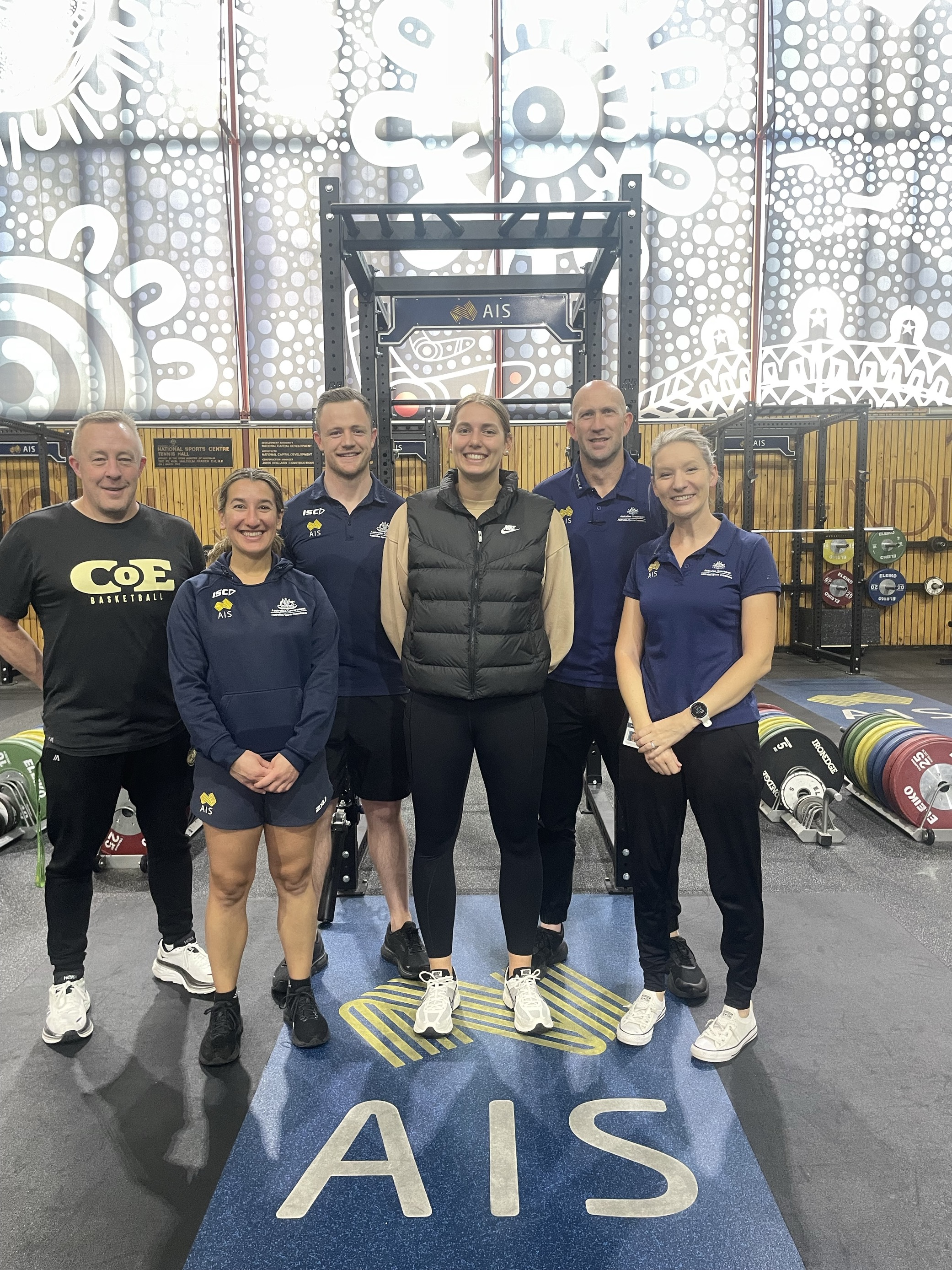 Isobel Borlase surrounded by members of the intensive rehabilitation team and Basketball Australia Centre of Excellence