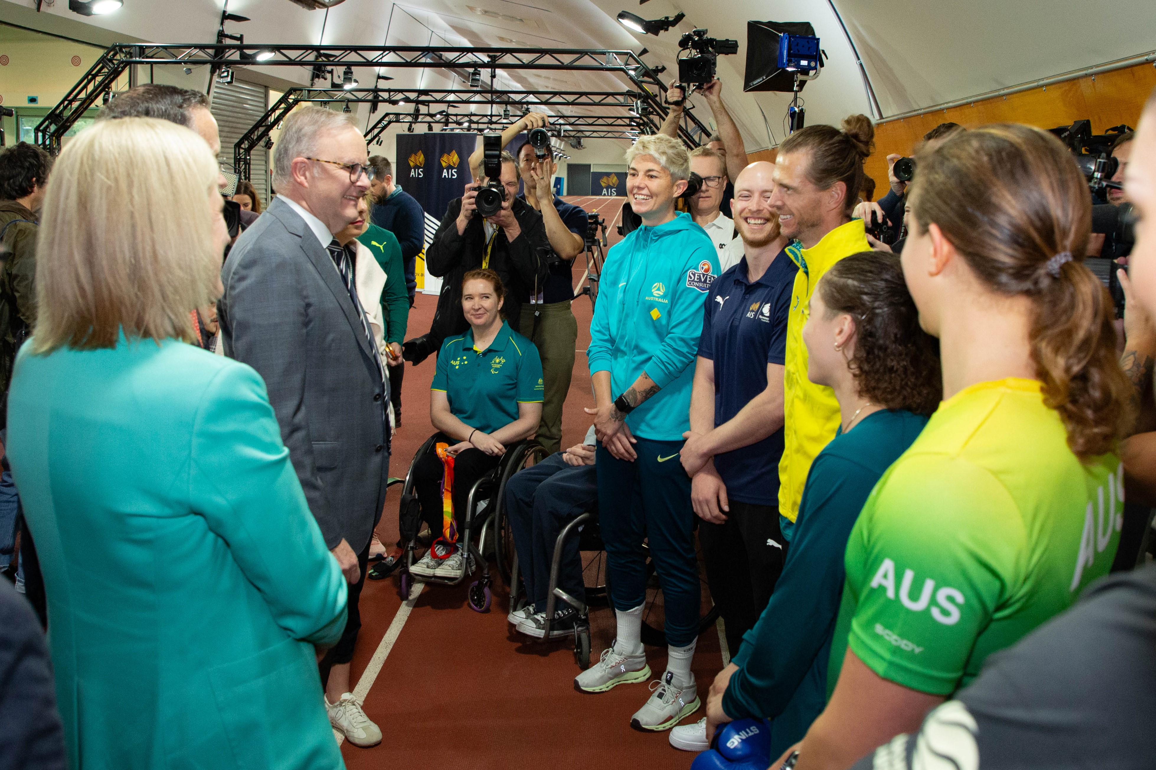 Athletes pictured with members of the Australian Government
