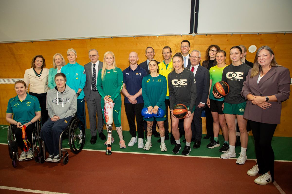 Group photo featuring members of the Australian Government with athletes at the AIS.  