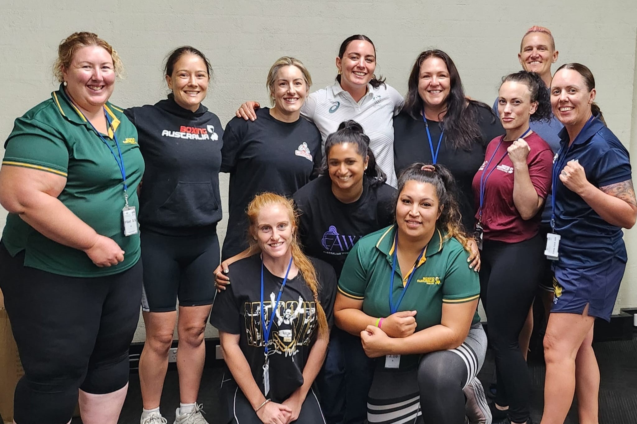 Caitlin Parker stands with the 10 women coaches who attended the Women's Development Camp