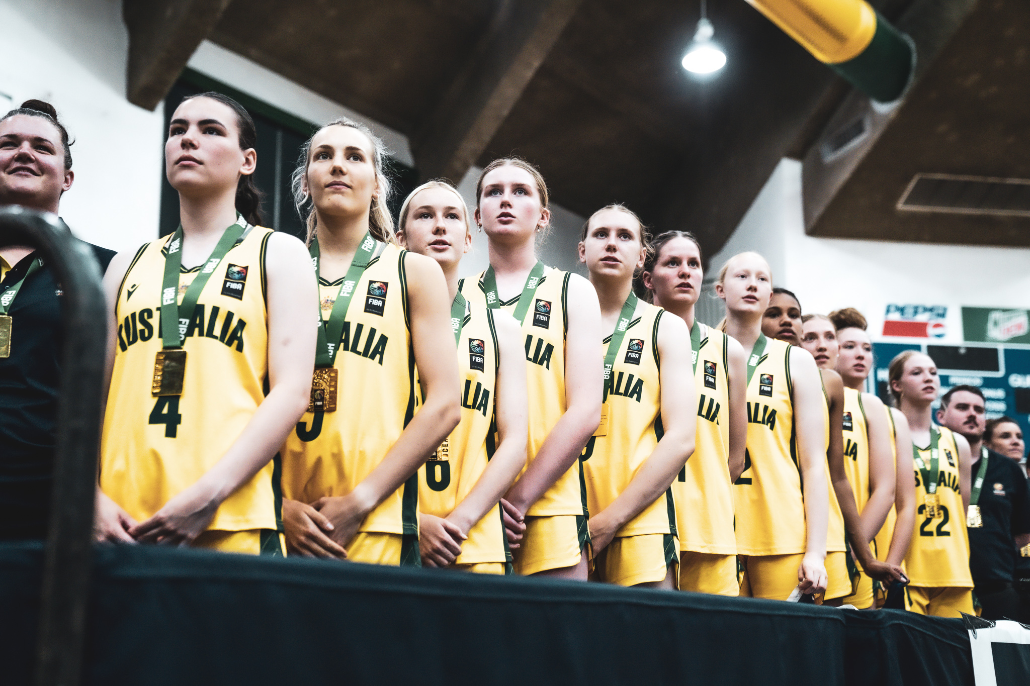 Australian Sapphires players standing in a line after being presented with their gold medals at the 2022 FIBA U15 Oceania Cup